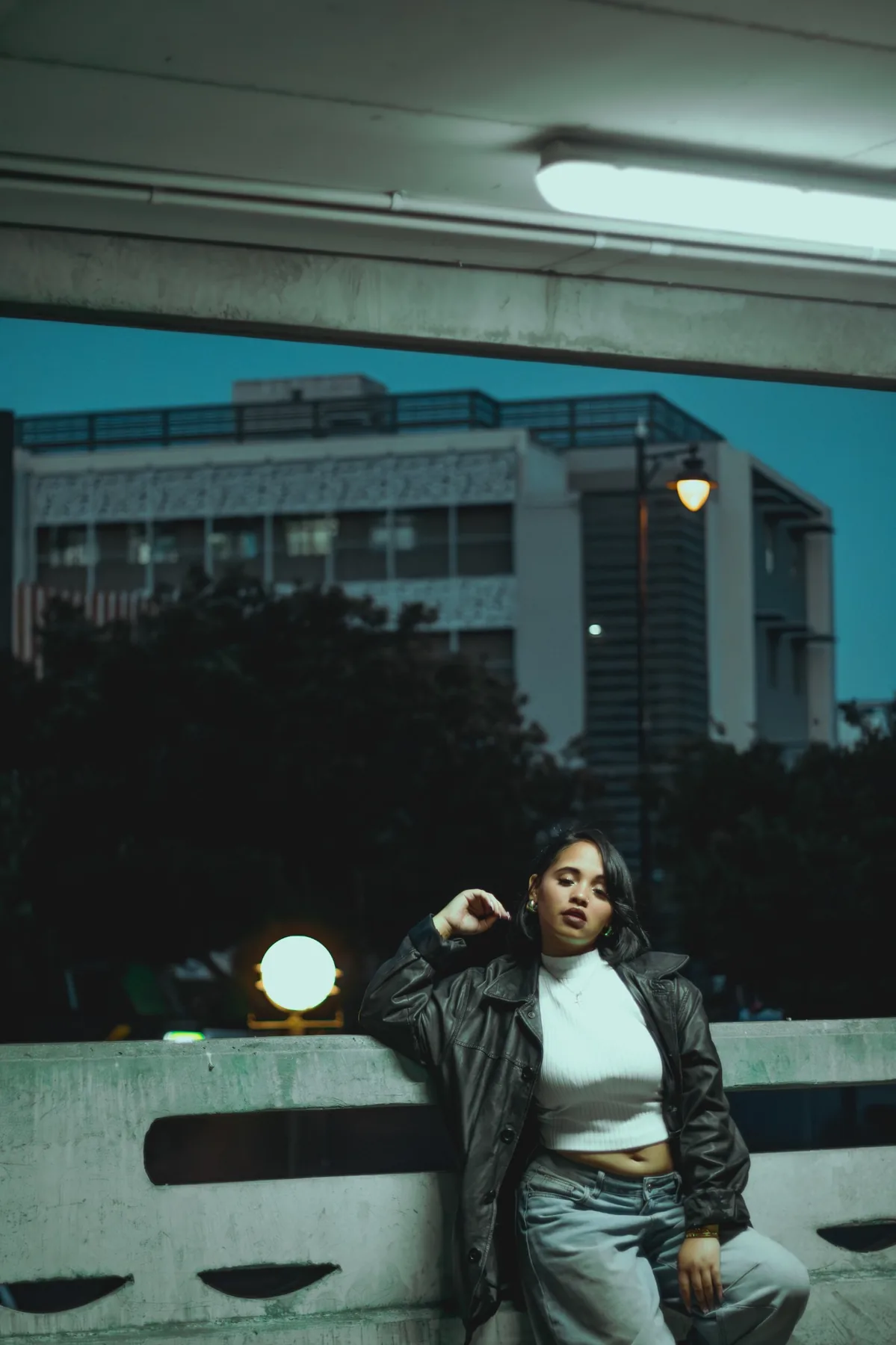 Portrait session in a parking structure at dusk